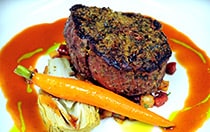 Steak, carrots and vegetables on a plate