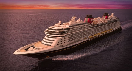 The Disney Destiny ship sailing on calm waters at sunset