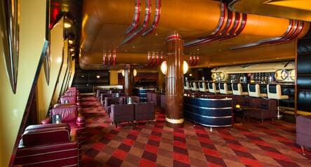 A car-themed lounge has décor modeled after the trim and detailing on classic Cadillac cars