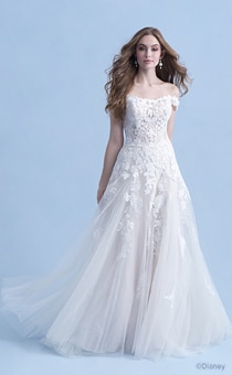 A woman in the Aurora wedding gown from the 2021 Disney Fairy Tale Weddings Collection