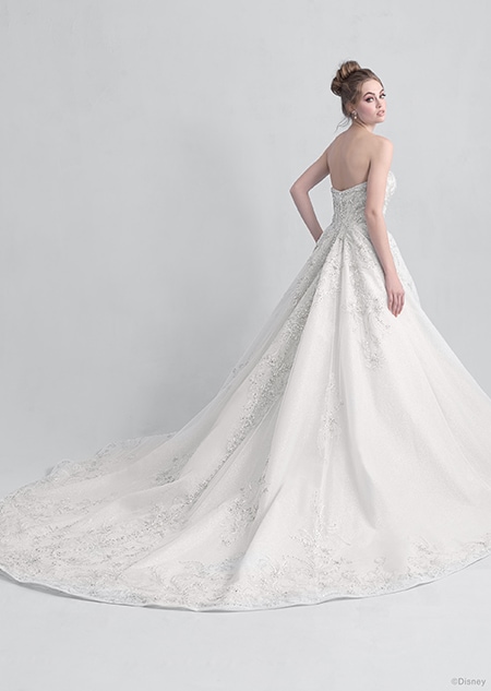 Backside view of a woman wearing the Cinderella wedding gown from the 2021 Disney Fairy Tale Weddings Platinum Collection