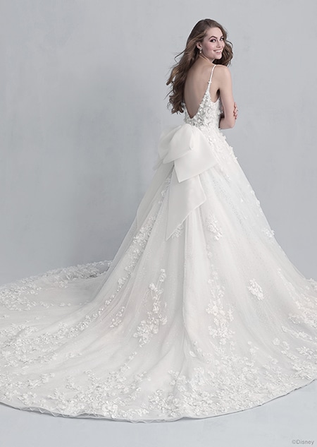 Backside view of a woman wearing the Snow White wedding gown from the 2021 Disney Fairy Tale Weddings Platinum Collection Backside view of a woman wearing the Snow White wedding gown from the 2021 Disney Fairy Tale Weddings Platinum Collection