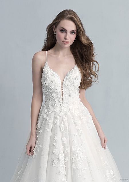 A front side view of a woman in the Snow White wedding gown from the 2021 Disney Fairy Tale Weddings Platinum Collection
