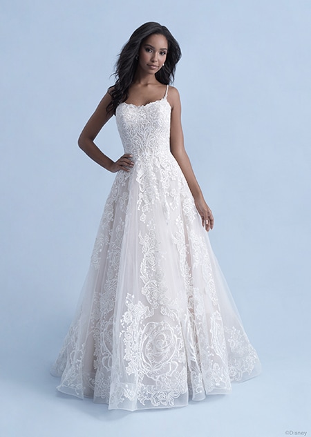 A woman wearing the Belle wedding gown from the 2021 Disney Fairy Tale Weddings Collection