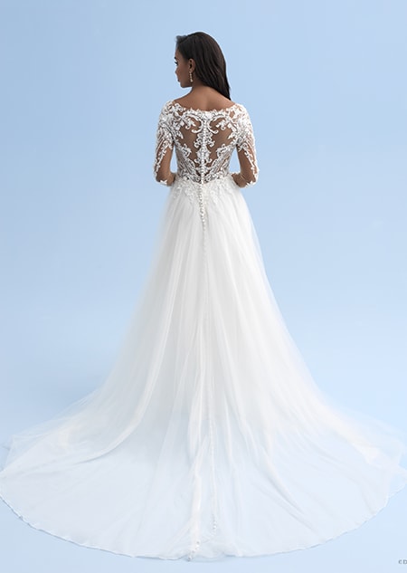 The back of a wedding dress with long sleeves and a partially see thru back The back of a wedding dress with long sleeves and a partially see thru back