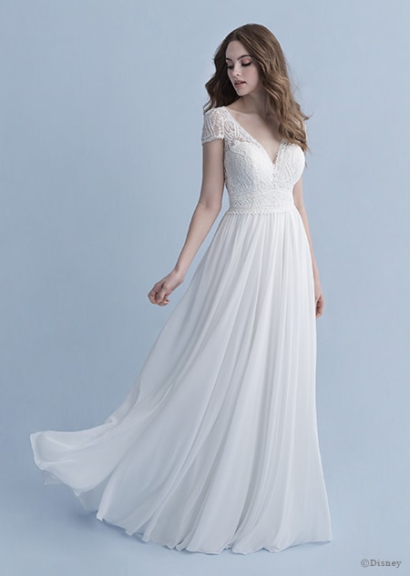 A woman in the Rapunzel wedding gown from the 2020 Disney Fairy Tale Weddings Collection A woman in the Rapunzel wedding gown from the 2020 Disney Fairy Tale Weddings Collection