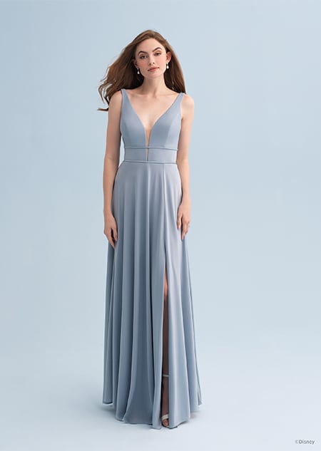 A woman wearing an Ariel themed bridesmaid dress with a plunging neckline