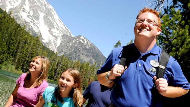 Know before you book Two girls with an Adventures by Disney Guide by a river in the mountains