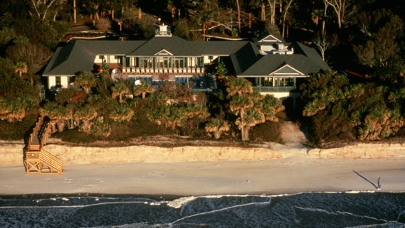 Disney's Beach House, with wooden walkway and stairs to the beach