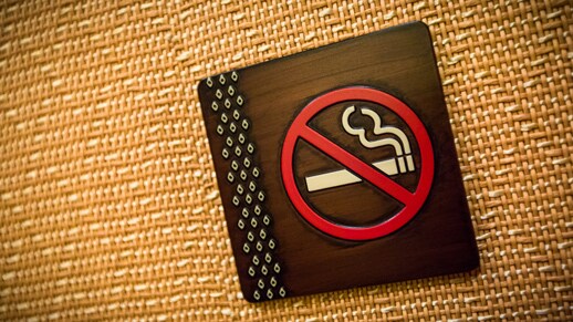 A sign featuring a no-smoking symbol