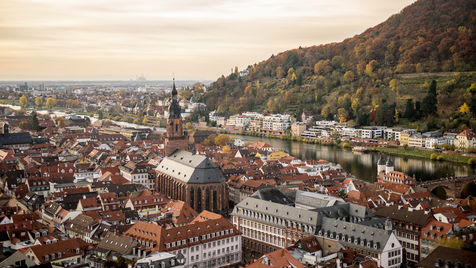 An overhead, sweeping view of a European city on a river