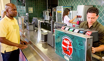 Guests serve themselves at a self-serve beverage counter