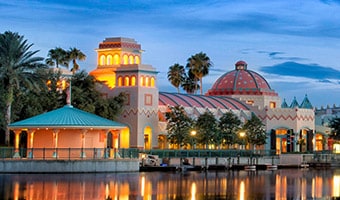 Disney's Coronado Springs Resort Spanish colonial buildings of Disney's Coronado Springs Resort on the edge of Lago Dorado at night