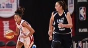 NBA Jr A female basketball player runs down court dribbling a basketball alongside an opponent at the Junior NBA World Championship event