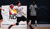 A dodgeball player holding a dodgeball, ready to throw it