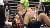 AAU Wrestling Scholastic Duals A wrestler pins his opponent to the mat